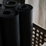 Yoga mat and accessories in a cold studio